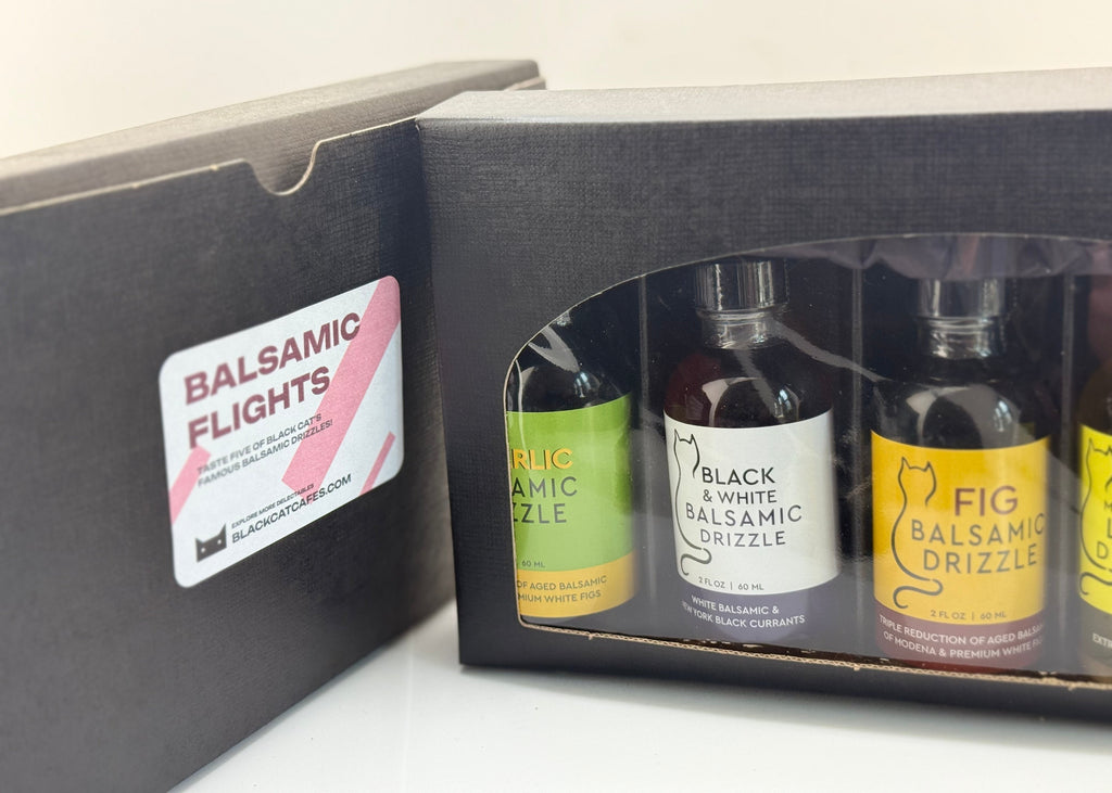 Balsamic vinegar flight set in a box with visible labels.